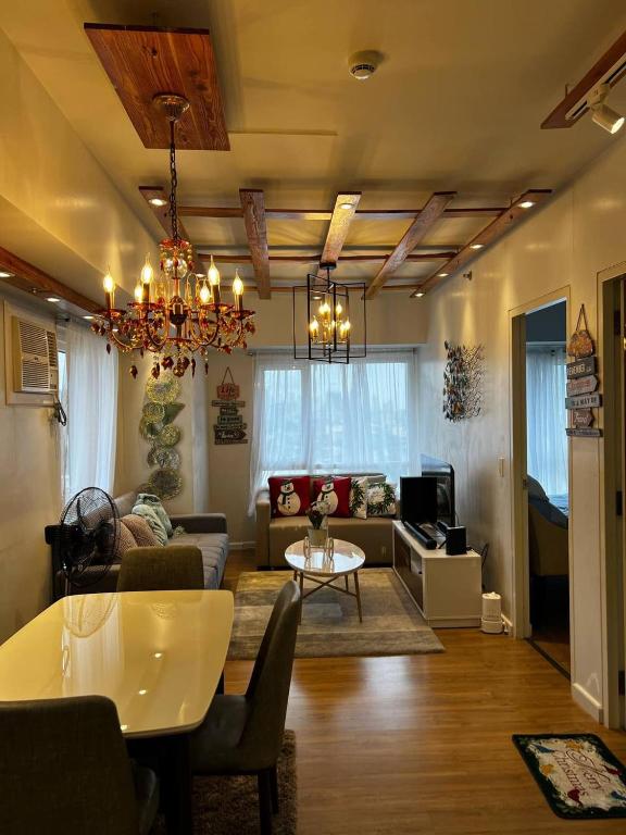 a living room with a couch and a table at Velasco Place in Manila