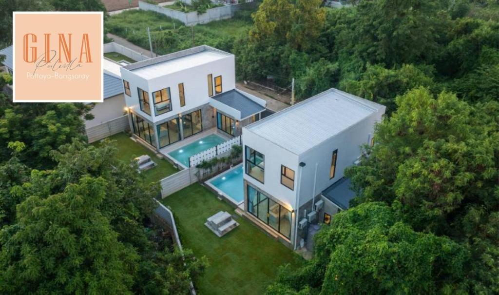 an aerial view of a house with a swimming pool at Gina Poolvilla90 Pattaya-Bangsaray to beach 900M in Bang Sare