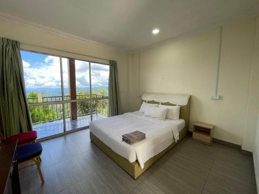 Postel nebo postele na pokoji v ubytování JR RESORT