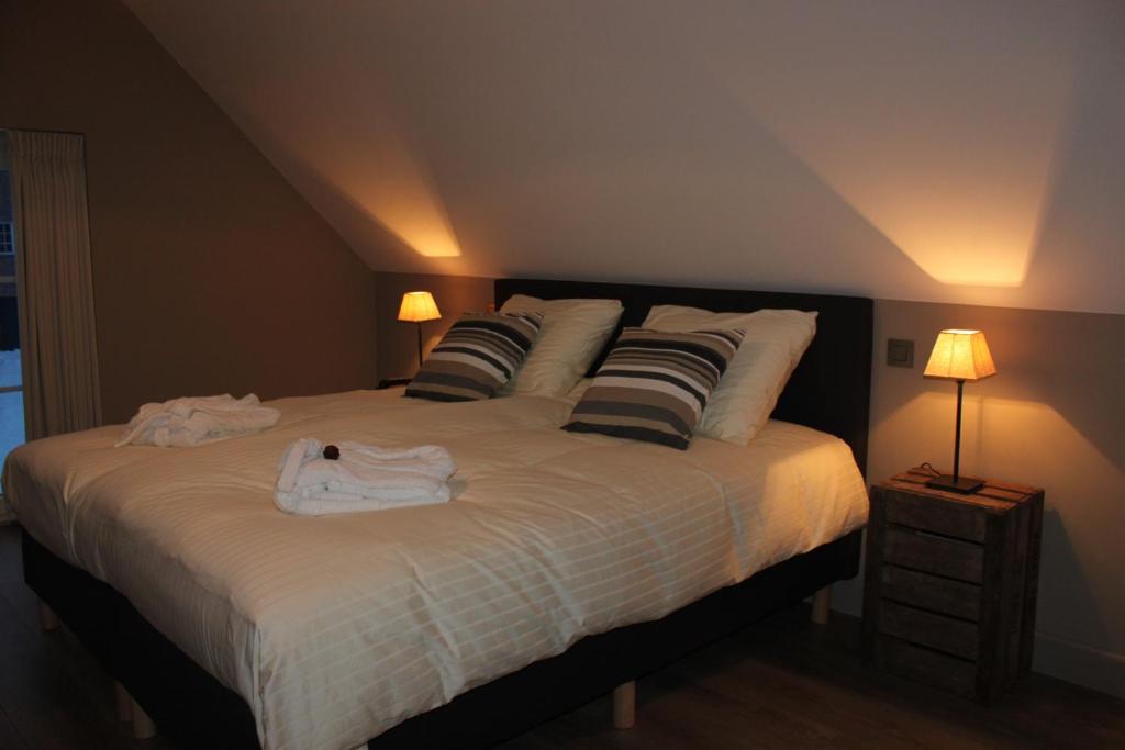 Postel nebo postele na pokoji v ubytování B&B de Rijcke Rust