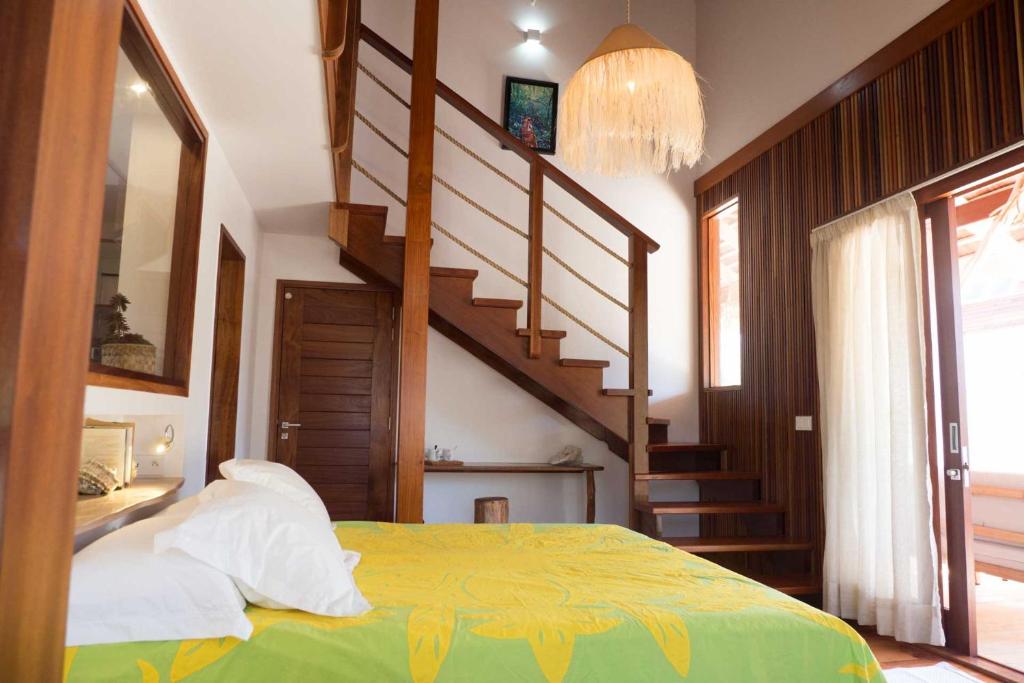 Postel nebo postele na pokoji v ubytování Moorea Reef Bungalows
