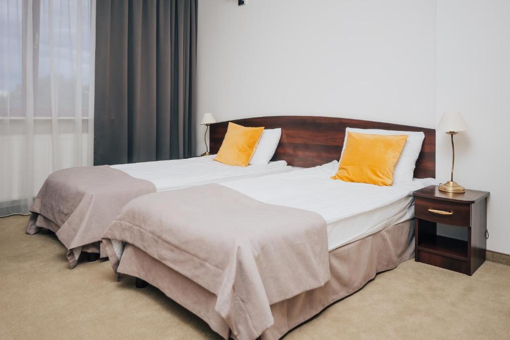 Postel nebo postele na pokoji v ubytování Hotel Sphinx