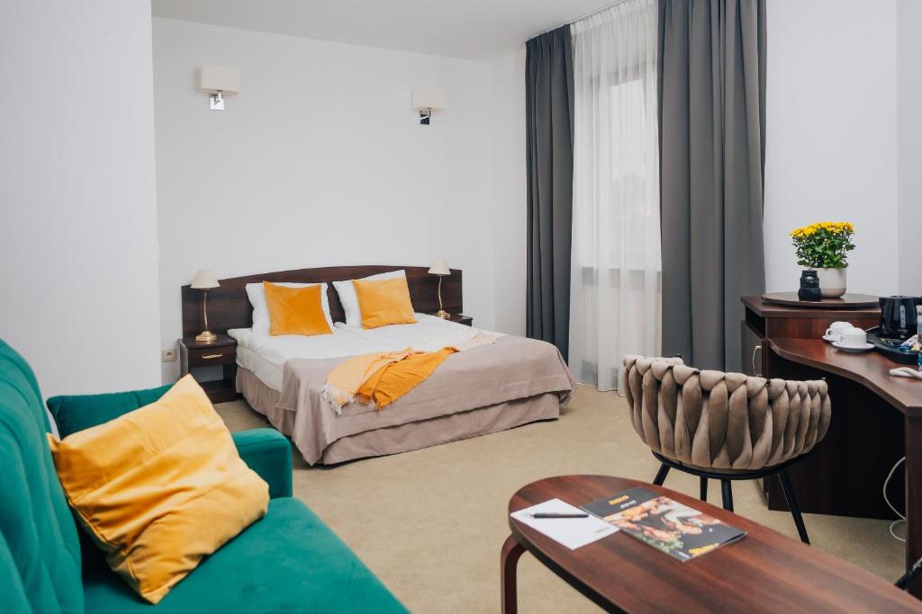 Postel nebo postele na pokoji v ubytování Hotel Sphinx