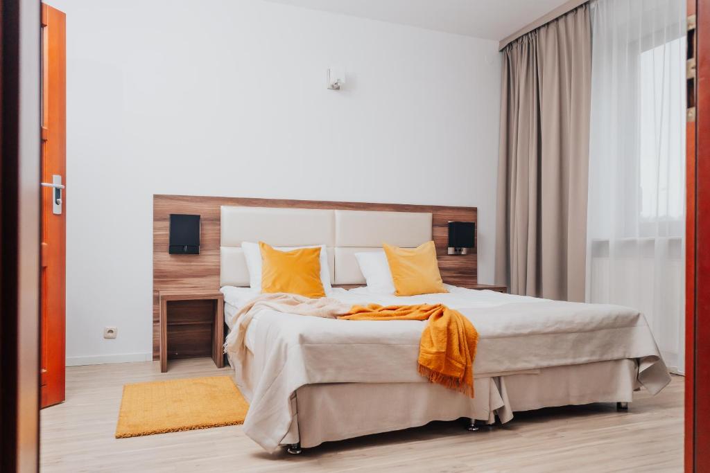 Postel nebo postele na pokoji v ubytování Hotel Sphinx