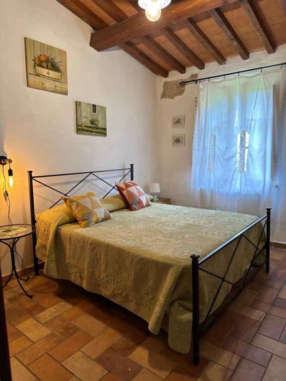 Postel nebo postele na pokoji v ubytování Residence Lucignano