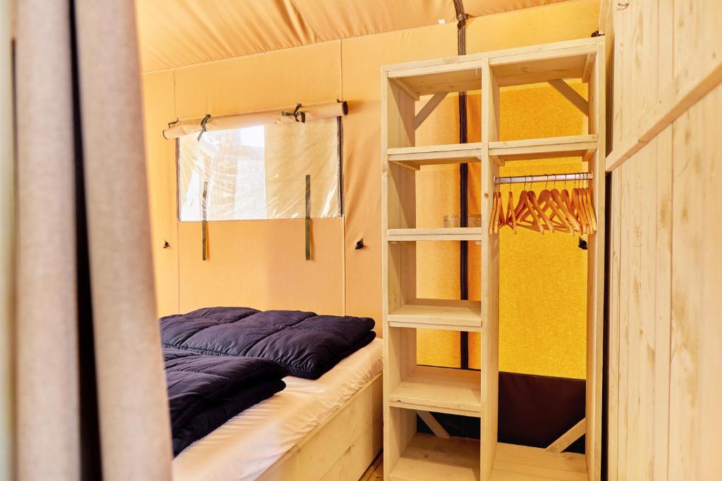 Postel nebo postele na pokoji v ubytování Glamping Costa Smeralda