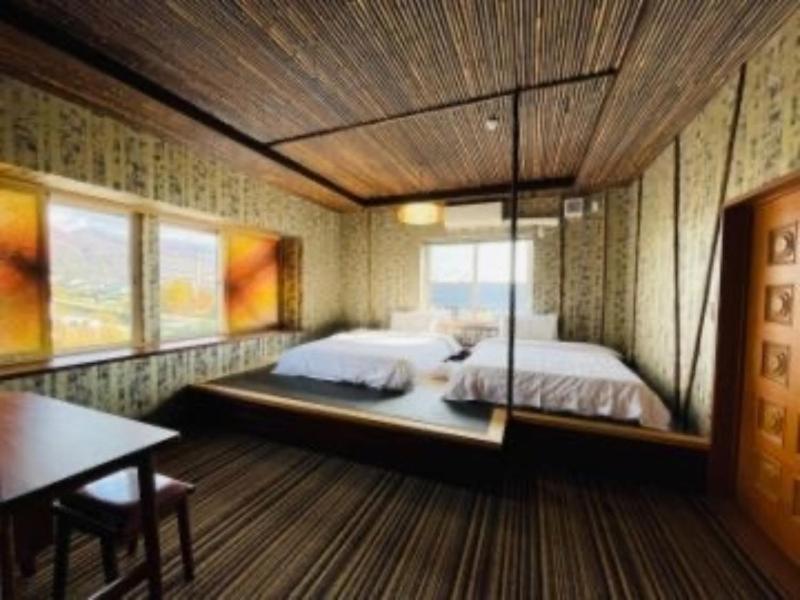 Postel nebo postele na pokoji v ubytování HOTEL COCOA RESORT