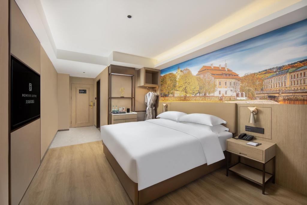 Postel nebo postele na pokoji v ubytování Landis Hotel