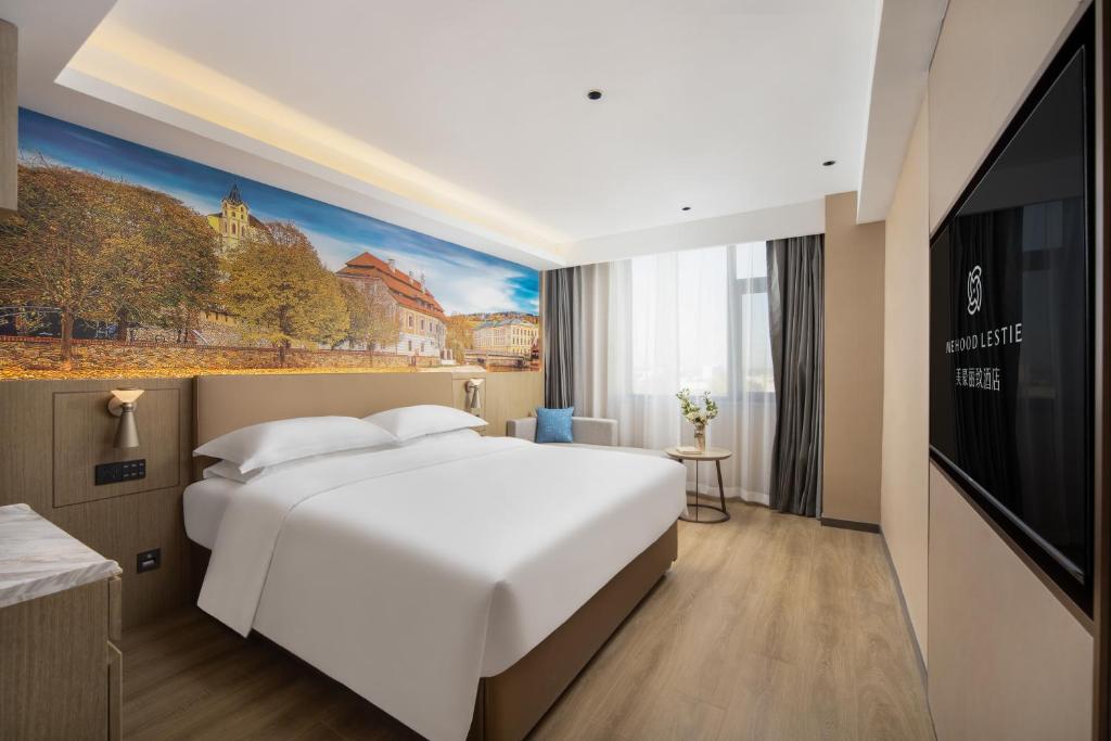 Postel nebo postele na pokoji v ubytování Landis Hotel