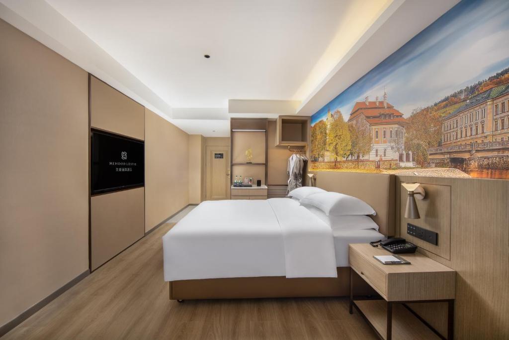 Postel nebo postele na pokoji v ubytování Landis Hotel