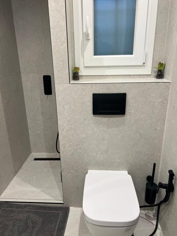 Koupelna v ubytování SimOtel Downtown Suite