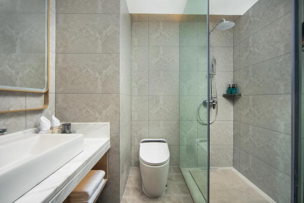 Koupelna v ubytování Landis Hotel