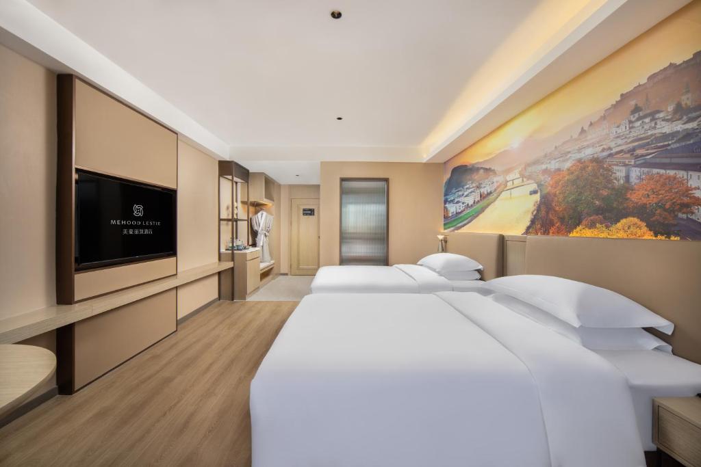 Postel nebo postele na pokoji v ubytování Landis Hotel
