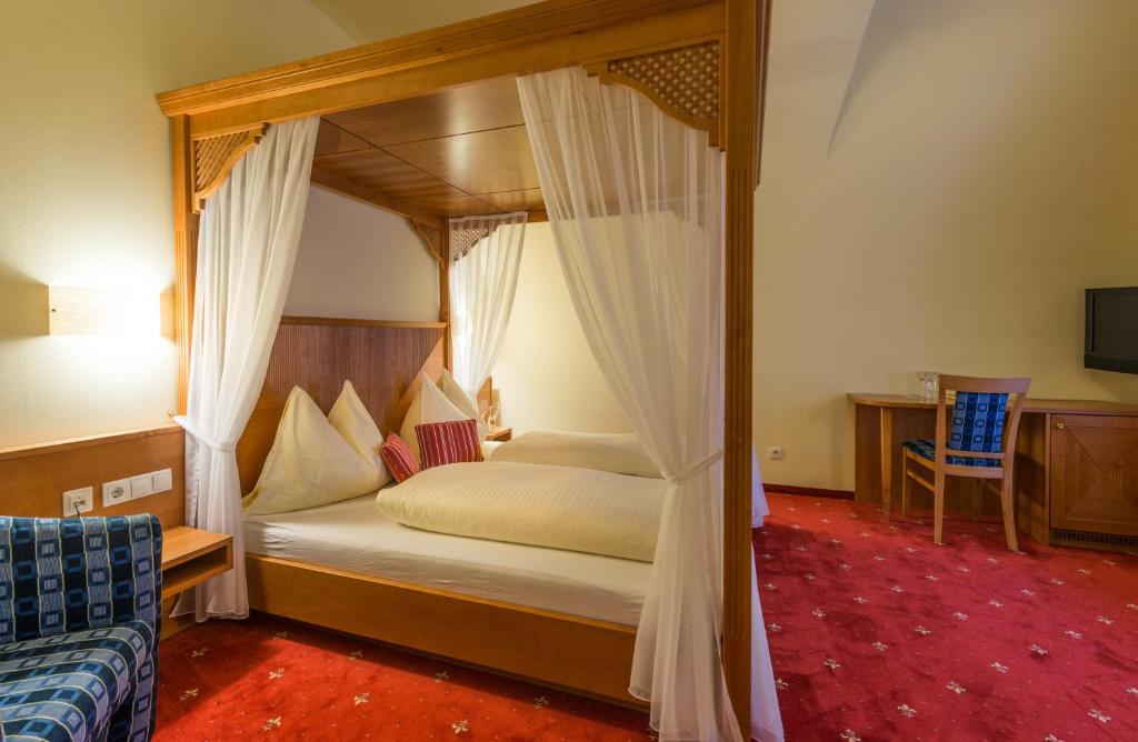 Postel nebo postele na pokoji v ubytování Posthotel Radstadt