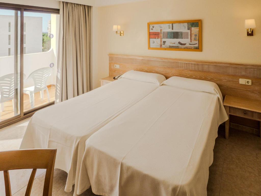 Postel nebo postele na pokoji v ubytování Hotel Santa Maria Playa