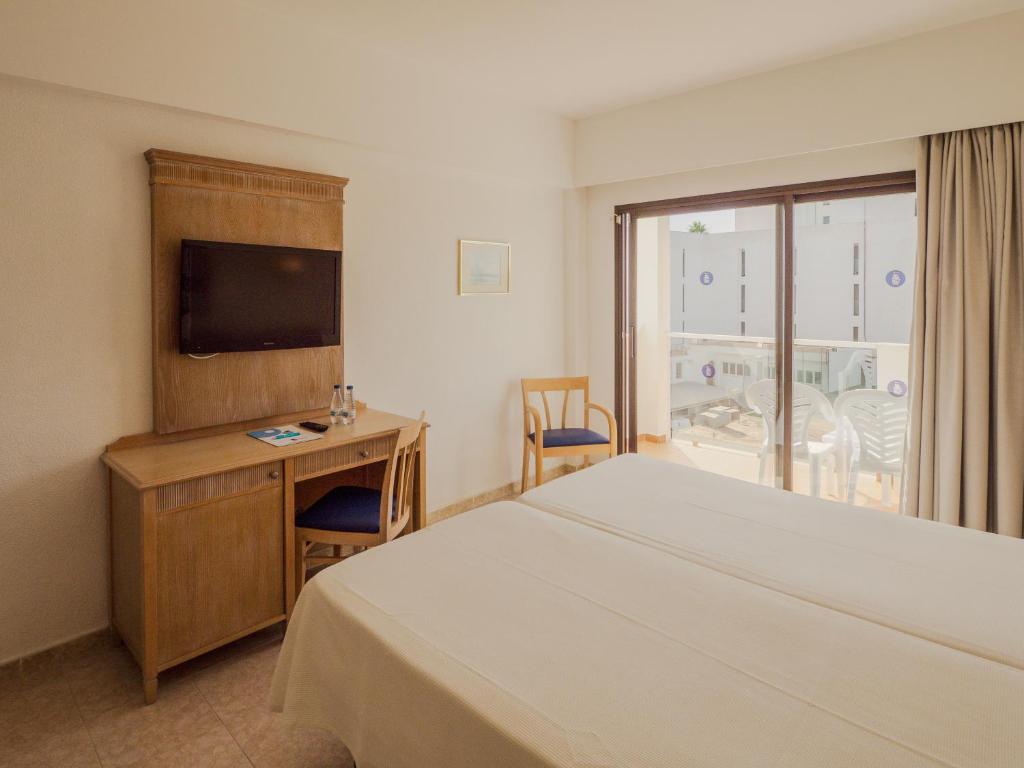 Postel nebo postele na pokoji v ubytování Hotel Santa Maria Playa