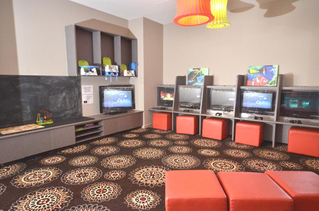 TV a/nebo společenská místnost v ubytování Gladstone Reef Hotel Motel