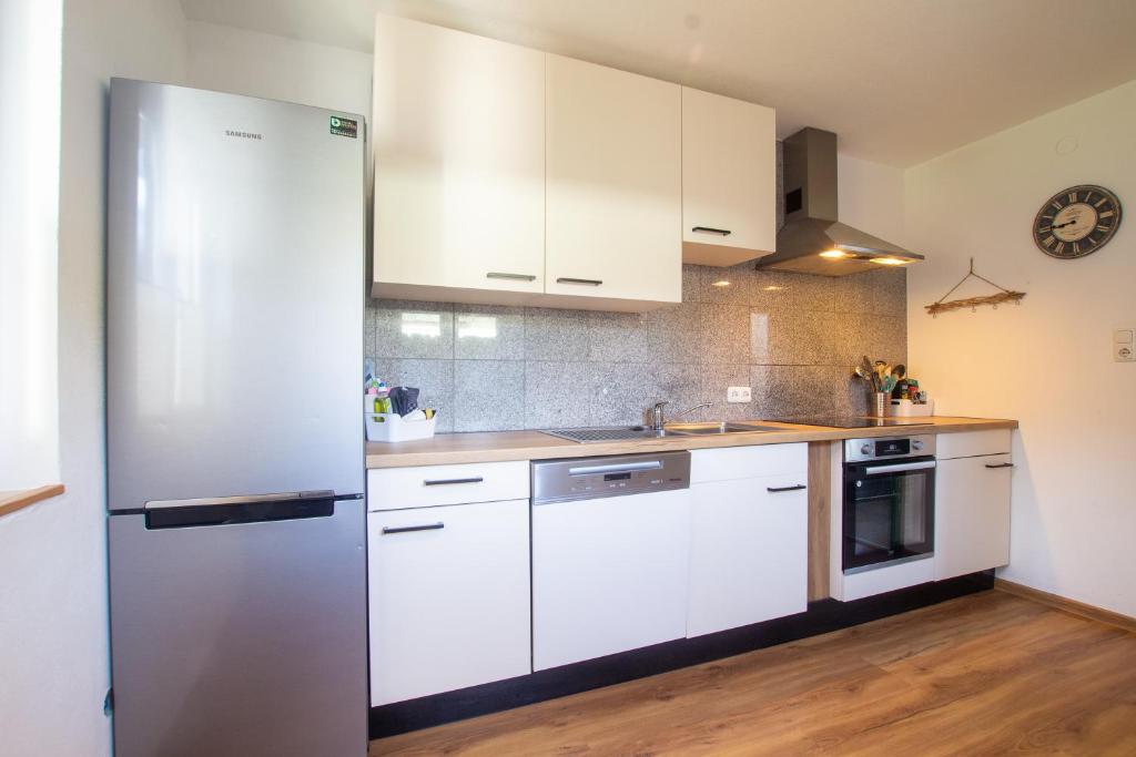 A kitchen or kitchenette at The Steinbock Lodge with garden and bbq