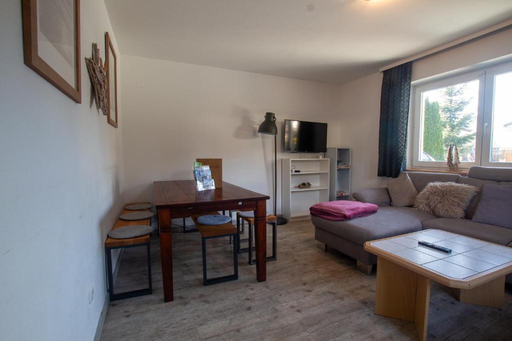 A television and/or entertainment centre at The Steinbock Lodge with garden and bbq