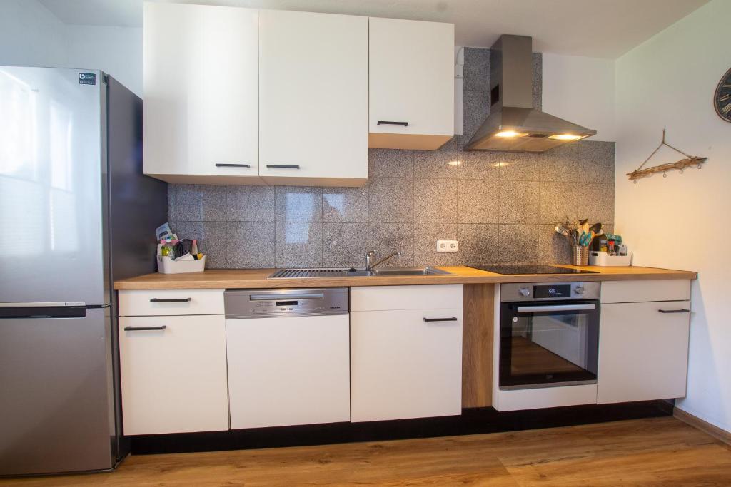 A kitchen or kitchenette at The Steinbock Lodge with garden and bbq