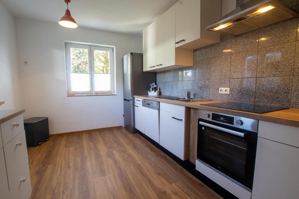 A kitchen or kitchenette at The Steinbock Lodge with garden and bbq