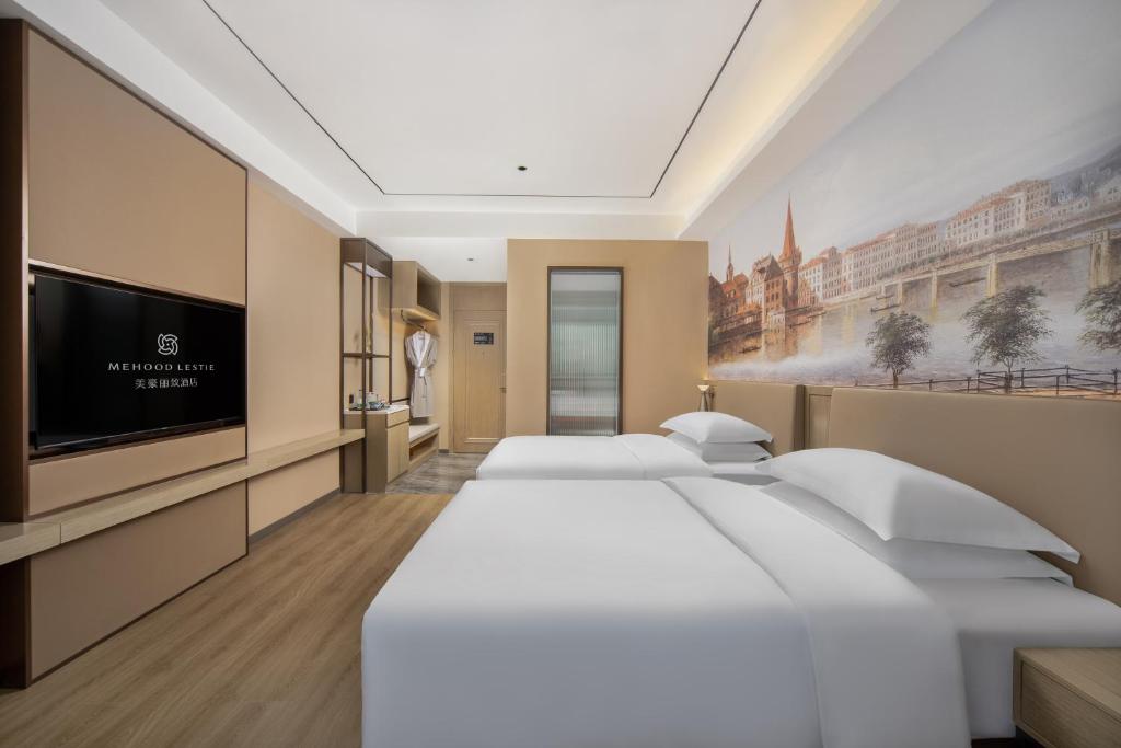 Postel nebo postele na pokoji v ubytování Landis Hotel