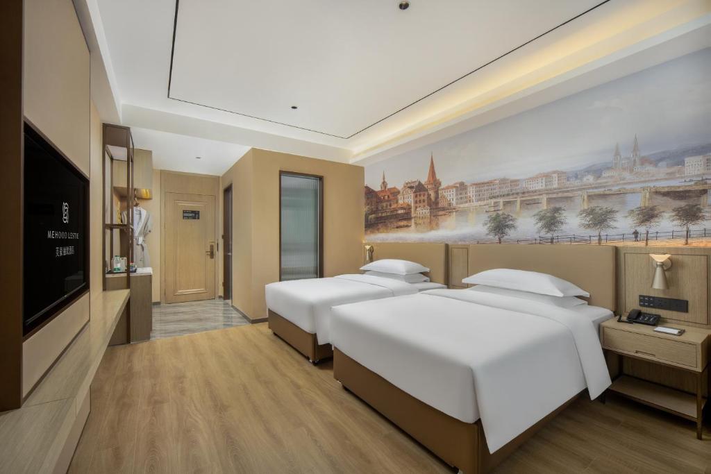 Postel nebo postele na pokoji v ubytování Landis Hotel