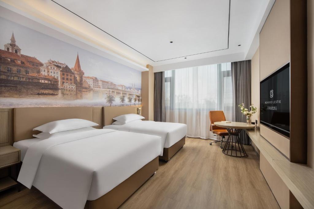 Postel nebo postele na pokoji v ubytování Landis Hotel