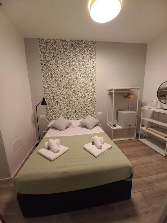 Postel nebo postele na pokoji v ubytování Rooms La Spezia 5 Terre