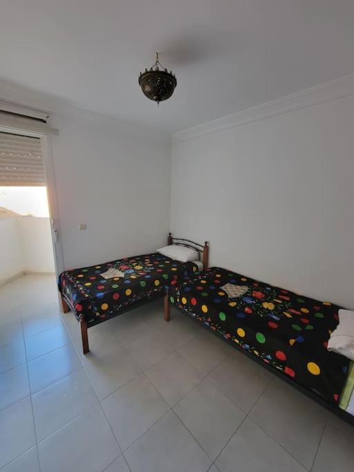 Postel nebo postele na pokoji v ubytování Appartement à Louer, MIftah Sahil Anza