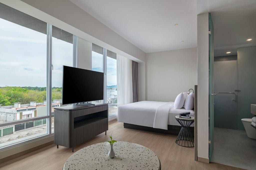 TV a/nebo společenská místnost v ubytování Hotel Santika Lahat