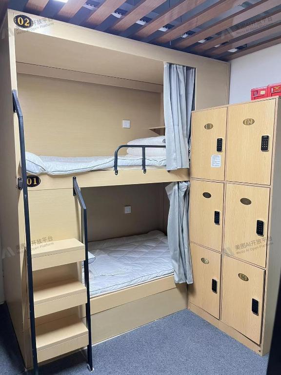 Postel nebo postele na pokoji v ubytování Zhihexing Youth Hostel-知和行青年酒店
