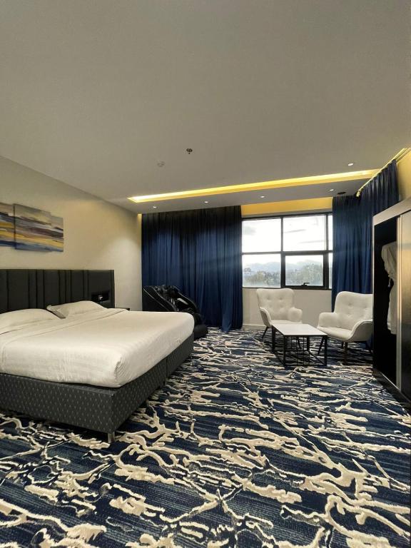 Postel nebo postele na pokoji v ubytování فندق قمم بارك Qimam Park Hotel 6