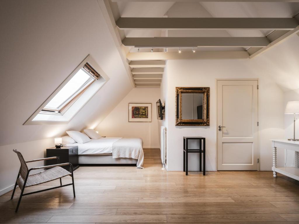 Een bed of bedden in een kamer bij Strandhotel Domburg