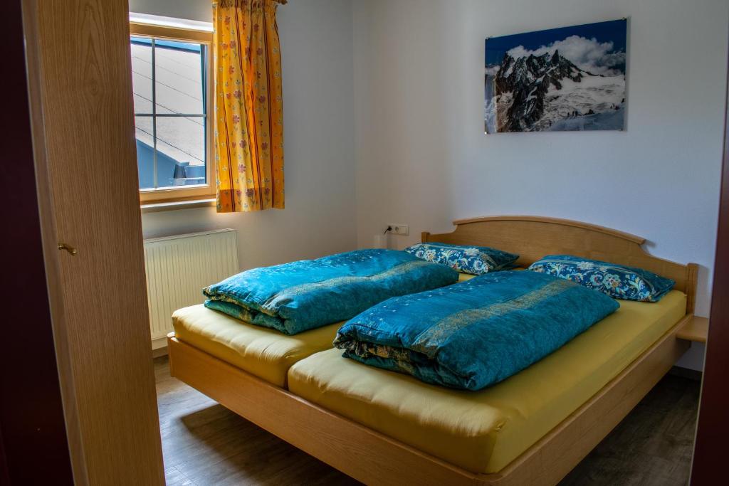 Postel nebo postele na pokoji v ubytování Reichenspitzblick Appartement
