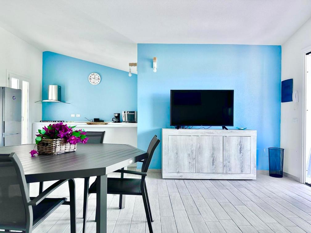 A television and/or entertainment centre at Villa Neni - Key to Villas