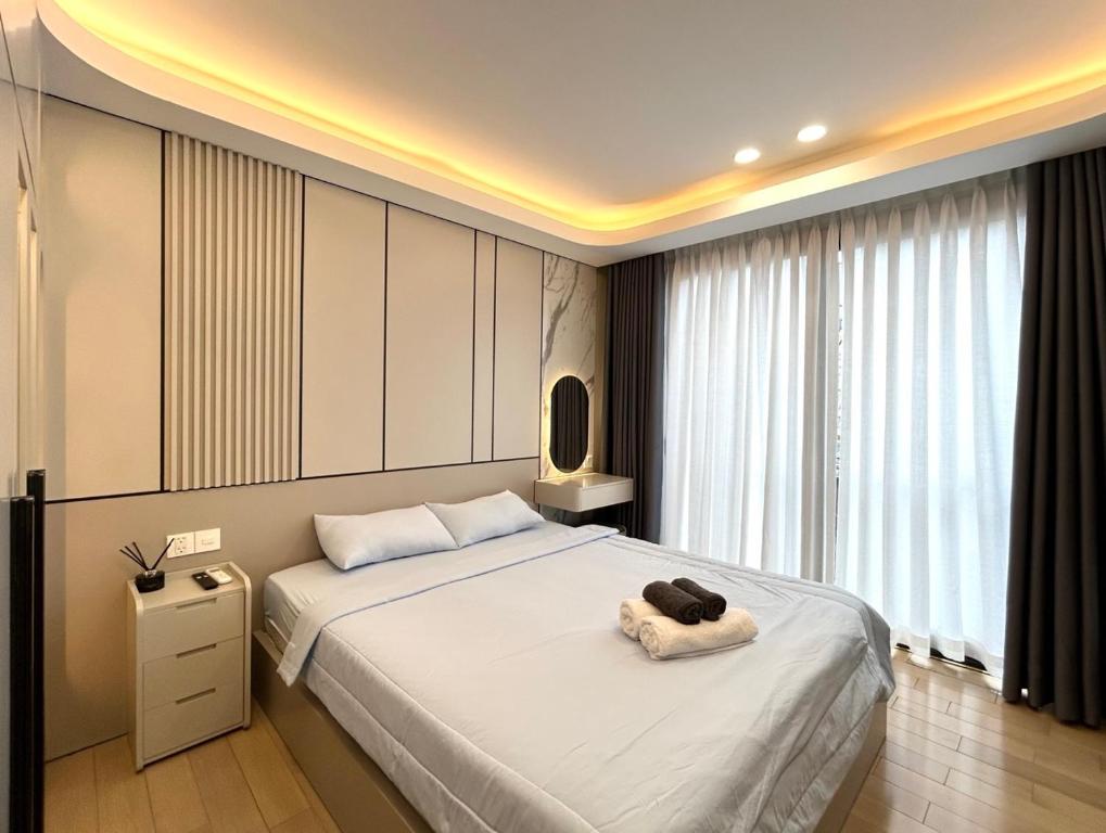 Postel nebo postele na pokoji v ubytování HOD Apartment Tan Dinh