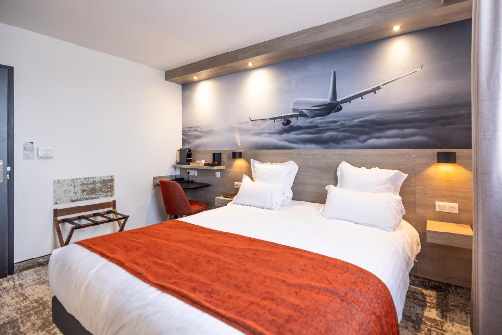 Postel nebo postele na pokoji v ubytování Best Western Saint Exupéry Eysines - Bordeaux Ouest