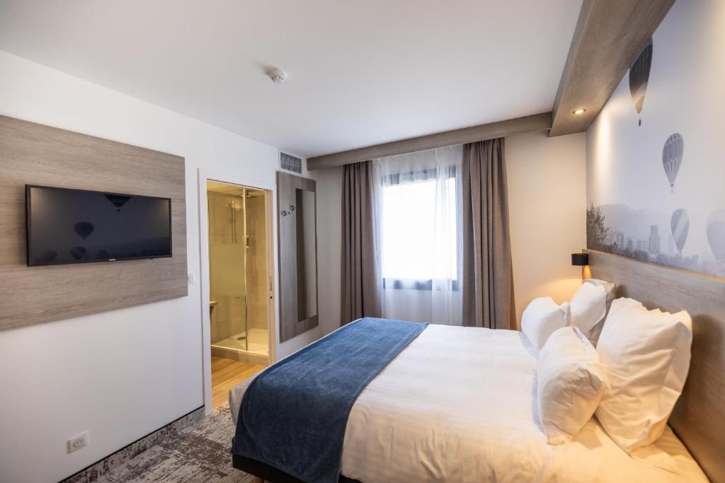 Postel nebo postele na pokoji v ubytování Best Western Saint Exupéry Eysines - Bordeaux Ouest