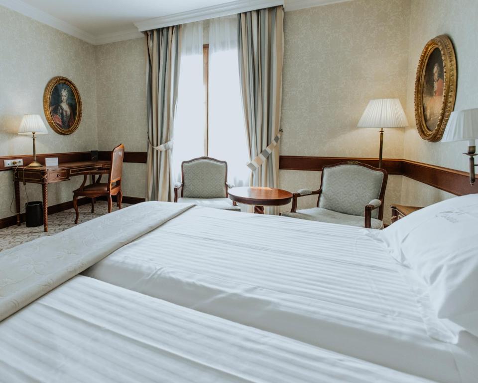 Postel nebo postele na pokoji v ubytování Hotel Cándido
