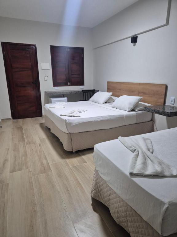 Postel nebo postele na pokoji v ubytování Pousada Arco Iris Fortaleza
