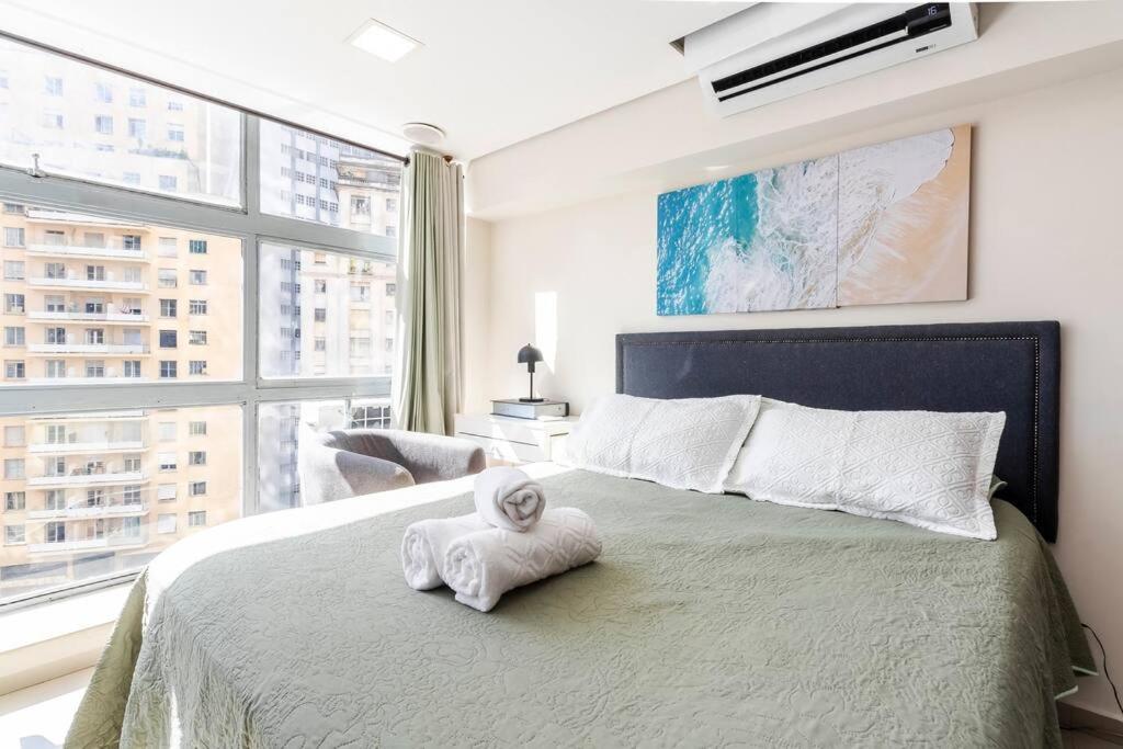 Una cama o camas en una habitación de Descolado e Completo SP