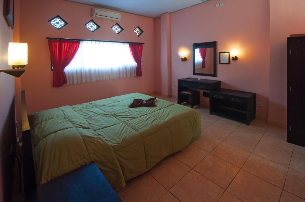 Postel nebo postele na pokoji v ubytování Pesona Beach Inn