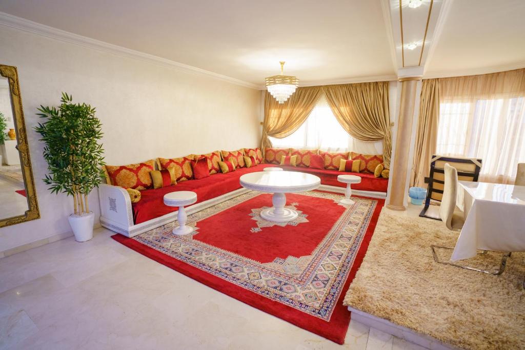 a living room with a couch and a table at Cozy apartment with stunning view near TGV station in Tangier