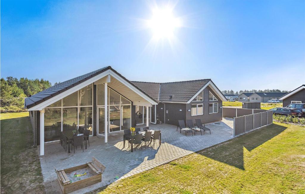 an aerial view of a house with a patio at Gorgeous Home In Nørre Nebel With Sauna in Nørre Nebel