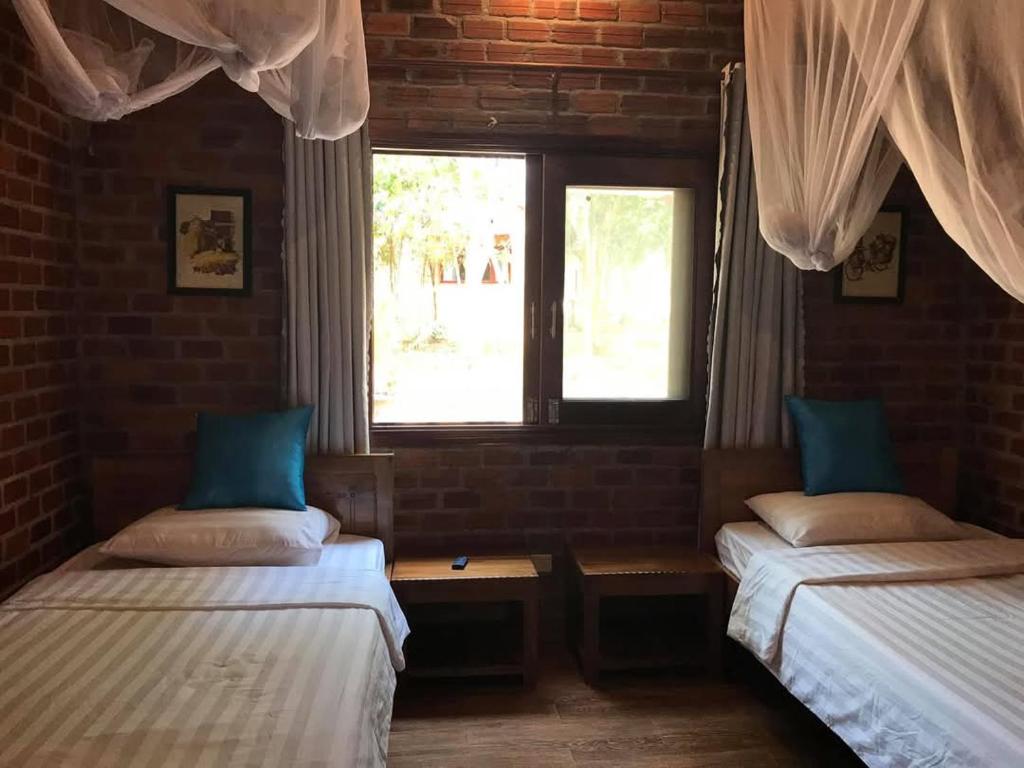 Giường trong phòng chung tại An Yen Resort