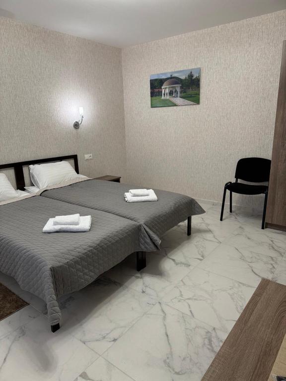 Postel nebo postele na pokoji v ubytování Hotel ELYSIUM