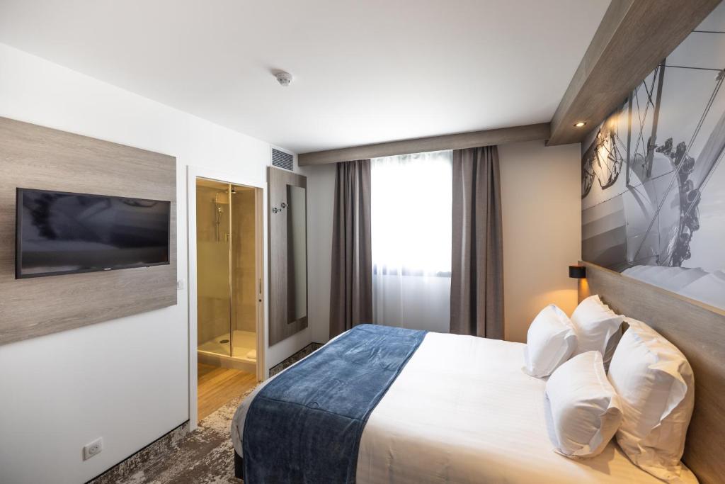 Postel nebo postele na pokoji v ubytování Best Western Saint Exupéry Eysines - Bordeaux Ouest