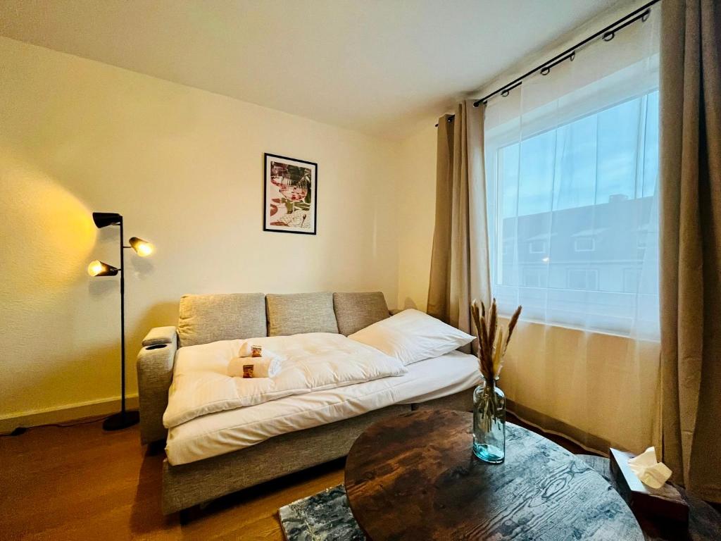 Giường trong phòng chung tại Immo-Vision Komfort & Entspannung Koblenz-Hauptbahnhof-Zentral
