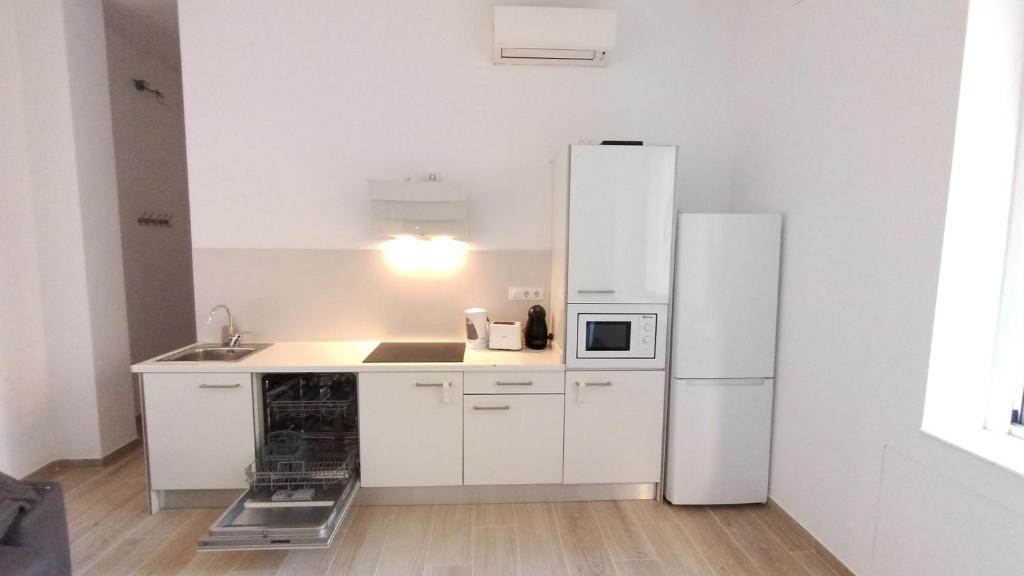Kuchyň nebo kuchyňský kout v ubytování Rosesapparts A20deMar Triplex